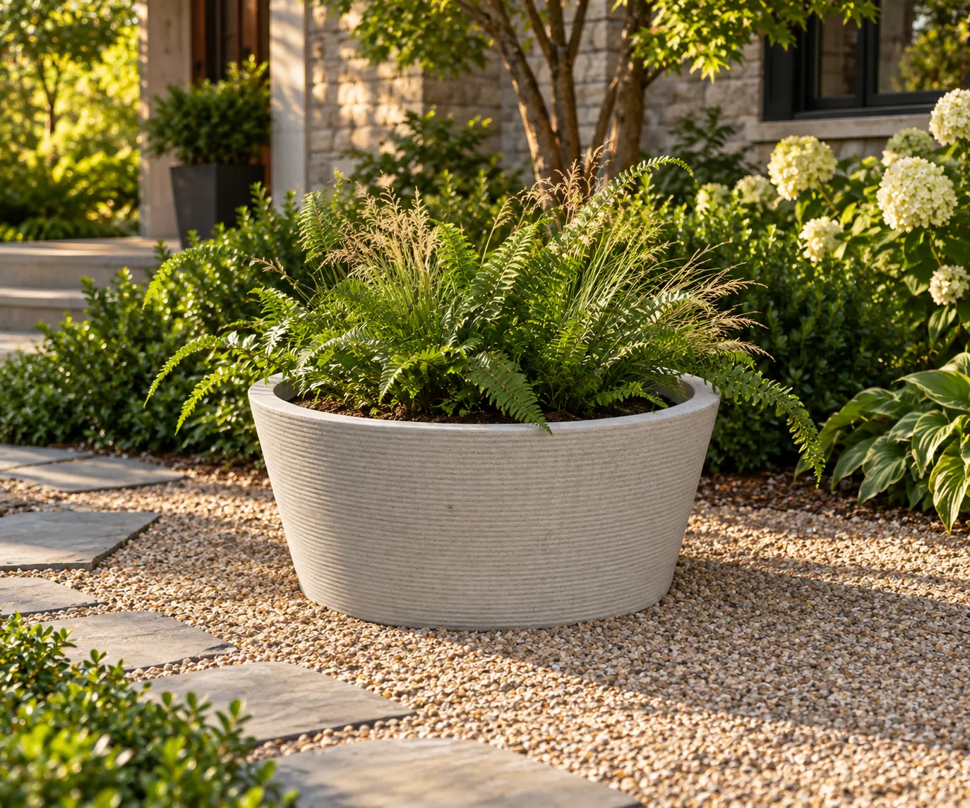 Illustration of the broad 1Contour Bowl planter in a garden setting