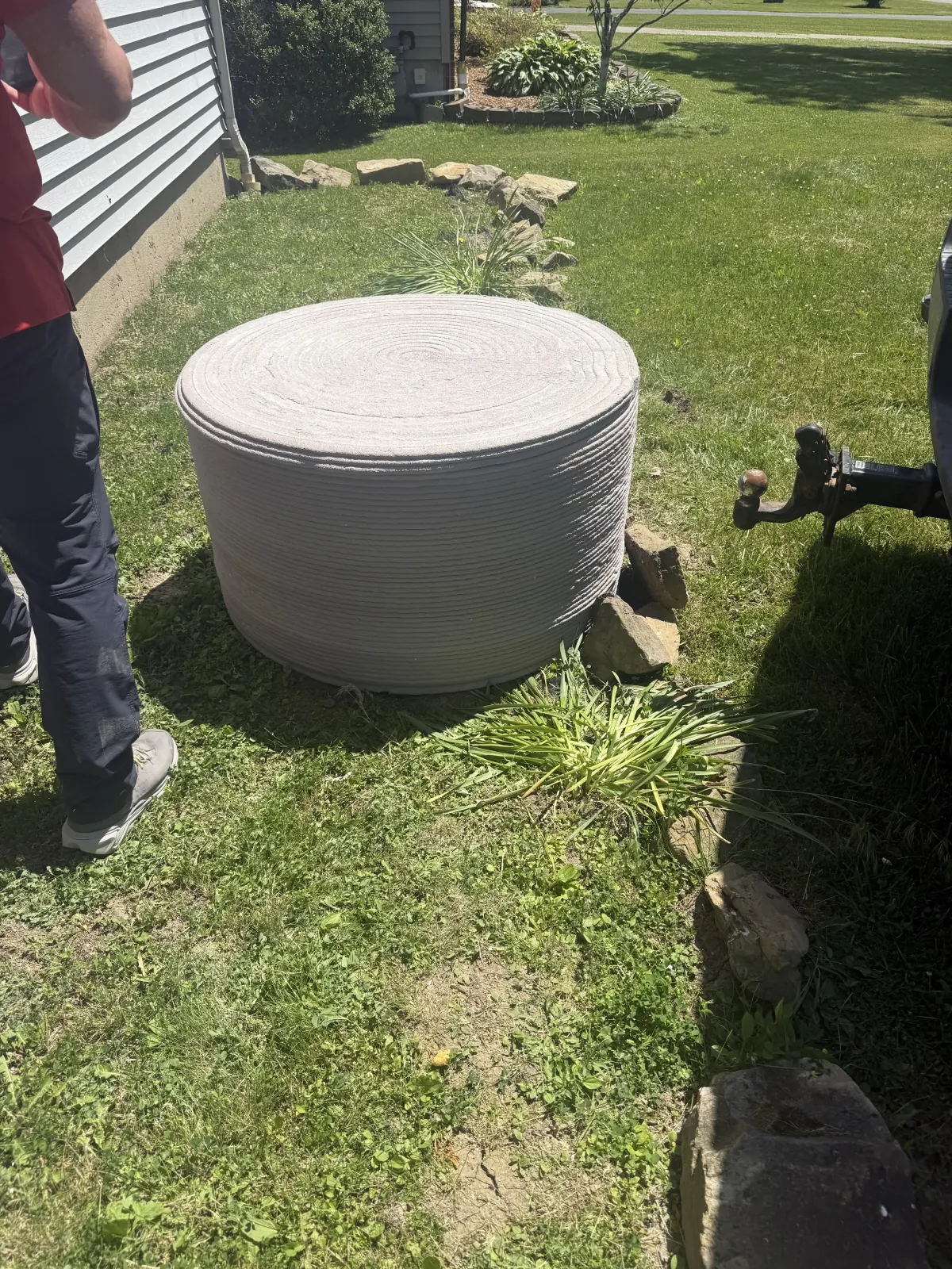 Round printed concrete form viewed from above and the side